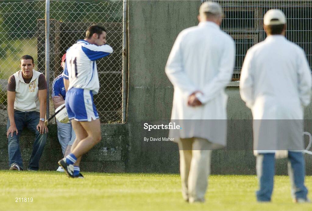 13 July 2006; Manchester United and Republic of Ireland International John O'Shea, extreme left, looks on as players and umpires leave the pitch for half-time. Munster Under 21 Hurling Championship, Quarter final, Waterford v Limerick. Fraher Field, Dungarvan, Co. Waterford. Picture credit; David Maher / SPORTSFILE