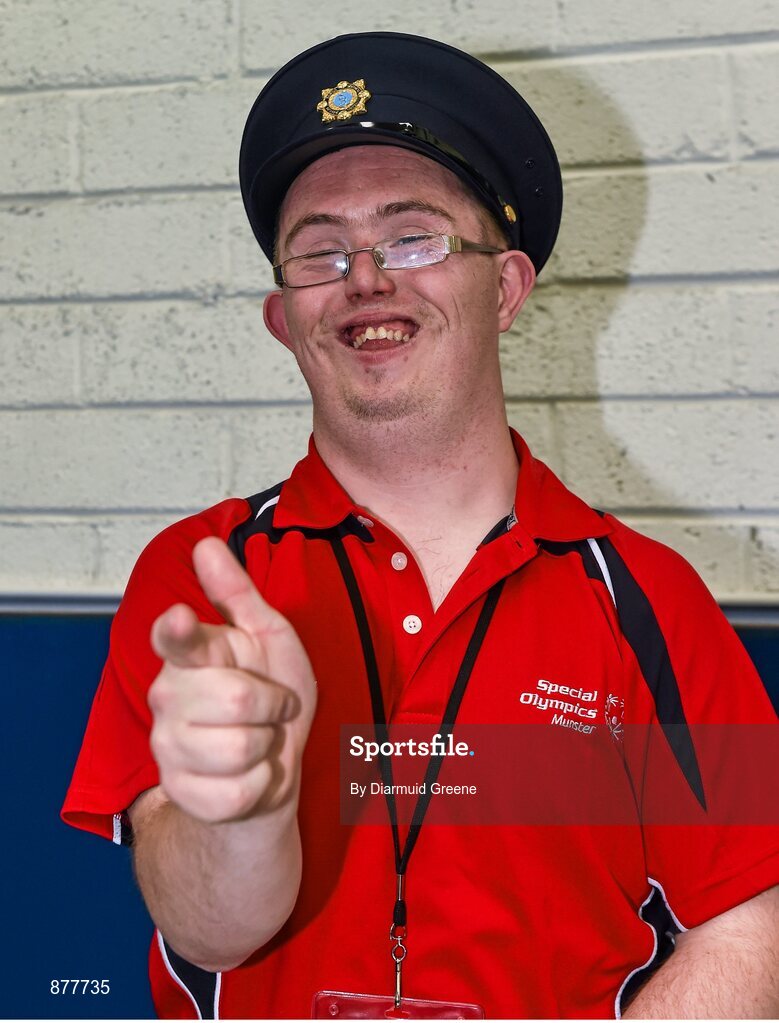 14 June 2014; Team Munster and Bocce athlete Damien O'Brien, Tipperary Town, Co. Tipperary, jokes around while wearing a hat belonging to a member of An Garda Siochana. Special Olympics Ireland Games, Delta Sports Dome, Limerick. Picture credit: Diarmuid Greene / SPORTSFILE