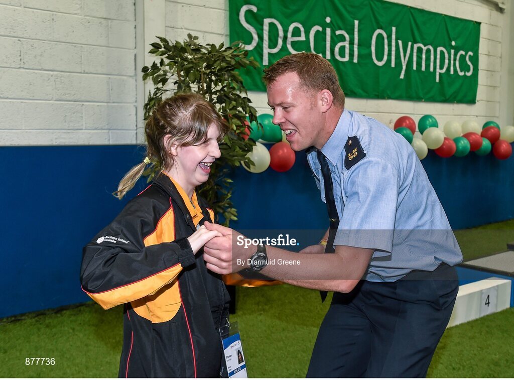 14 June 2014; Bocce athlete Phoebe Dalrymple, Ballymena, Co. Antrim, Team Ulster, dances with Garda Dermot Keating, from Henry St Garda Station, Limerick, after a medal ceremony. Special Olympics Ireland Games, Delta Sports Dome, Limerick. Picture credit: Diarmuid Greene / SPORTSFILE
