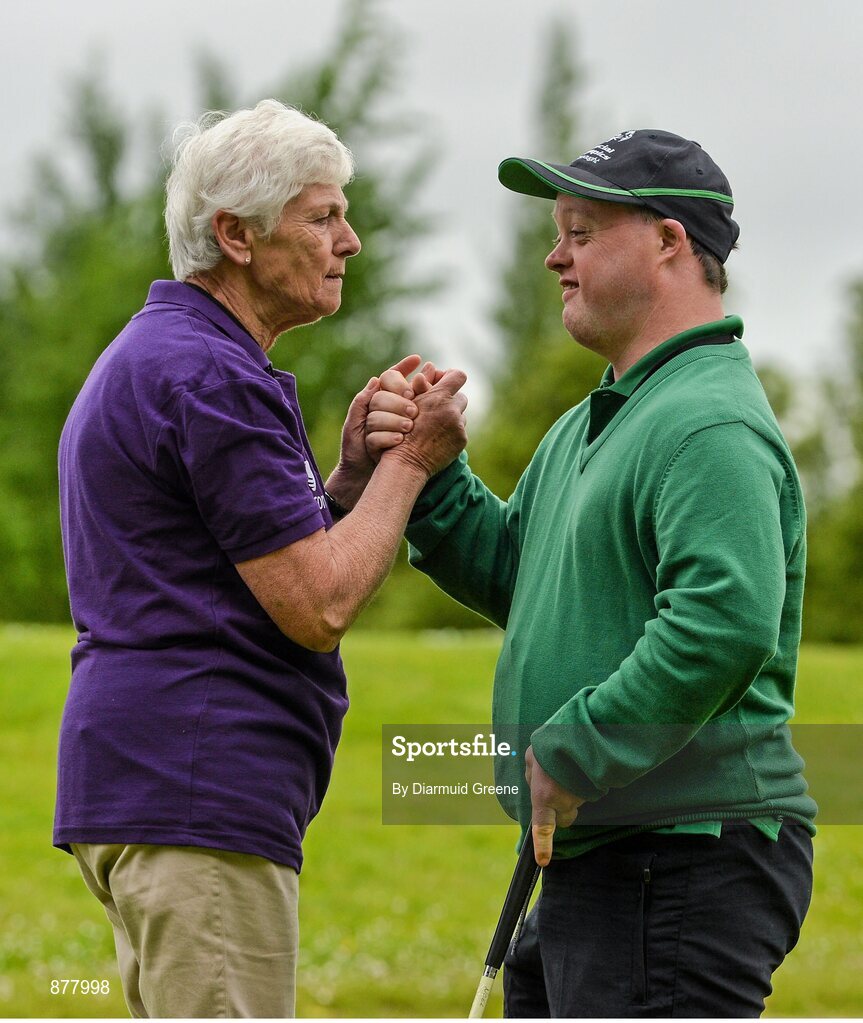 14 June 2014; Golfer Noel Doherty, Enniscrone, Co. Sligo, Team Connaught, exchanges a handshake with volunteer Claire Riordan, Tipperary Town, Co. Tipperary, after competing in the Short Putt event. Special Olympics Ireland Games, Ballykisteen Hotel & Golf Resort, Co. Tipperary. Picture credit: Diarmuid Greene / SPORTSFILE