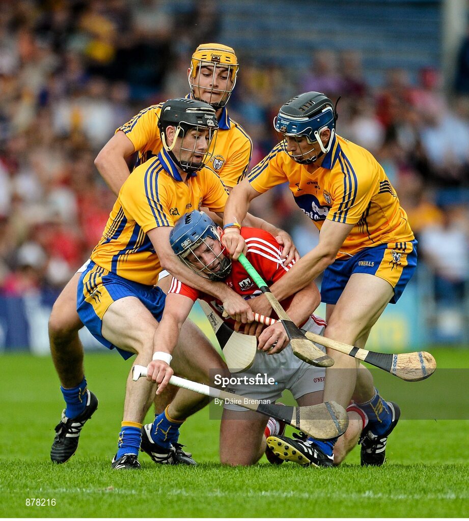 15 June 2014; Patrick Horgan, Cork, in action against Clare players, left to right, Patrick Donnellan, Peter Duggan and David McInerney. Munster GAA Hurling Senior Championship, Semi-Final, Clare v Cork, Semple Stadium, Thurles, Co. Tipperary. Picture credit: Dáire Brennan / SPORTSFILE