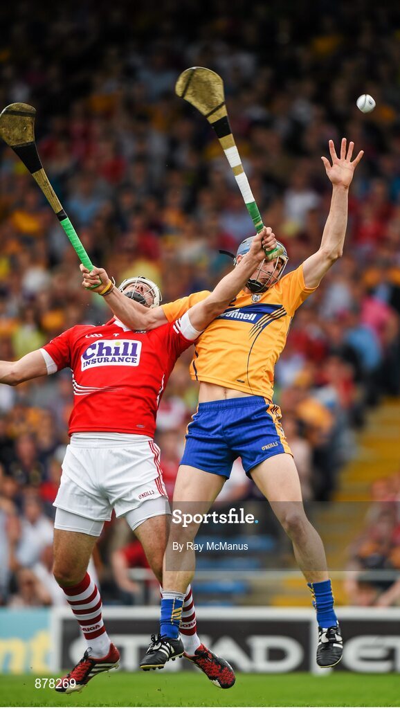 15 June 2014; David McInerney, Clare, reaches for a high ball with Patrick Cronin, Cork. Munster GAA Hurling Senior Championship, Semi-Final, Clare v Cork, Semple Stadium, Thurles, Co. Tipperary. Picture credit: Ray McManus / SPORTSFILE