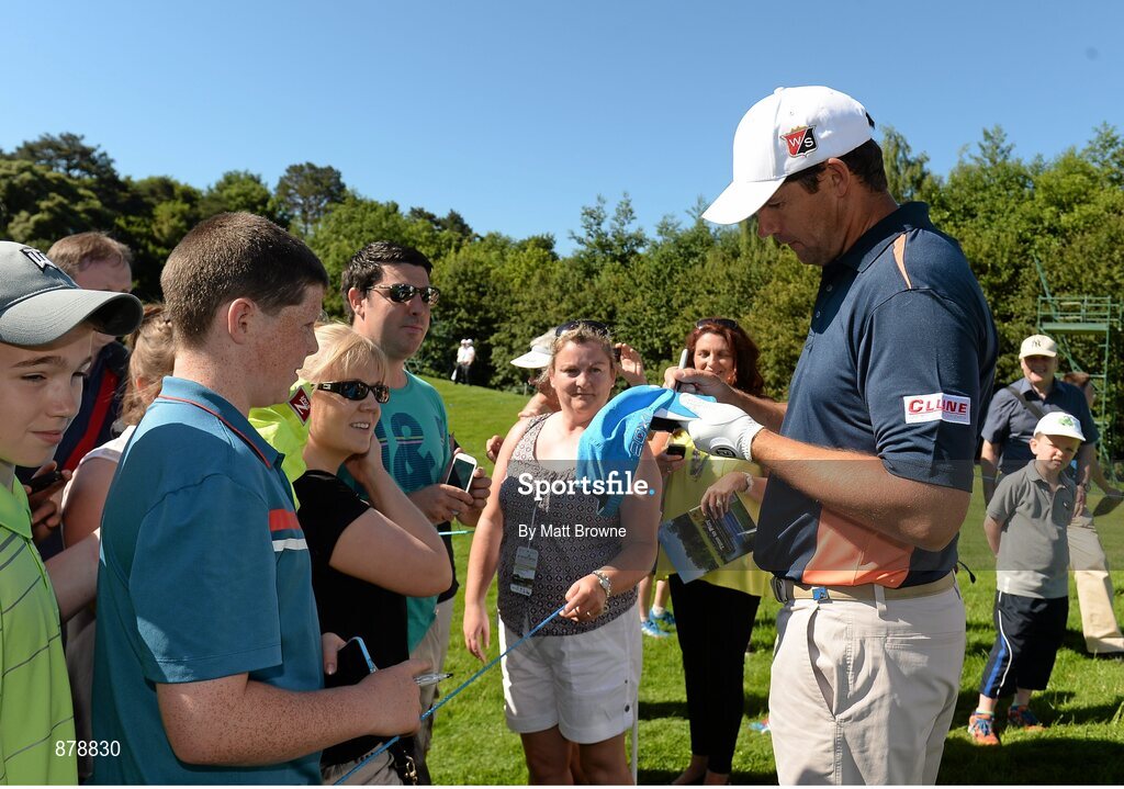 18 June 2014; Padraig Harrington signs autographs for fans during the 2014 Irish Open Golf Championship Pro-Am. Fota Island, Cork. Picture credit: Matt Browne / SPORTSFILE