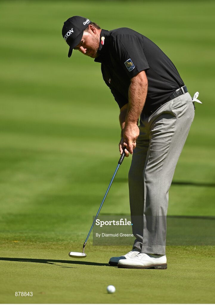 18 June 2014; Graeme McDowell watches his putt on the fifteenth green during the 2014 Irish Open Golf Championship Pro-Am. Fota Island, Cork. Picture credit: Diarmuid Greene / SPORTSFILE