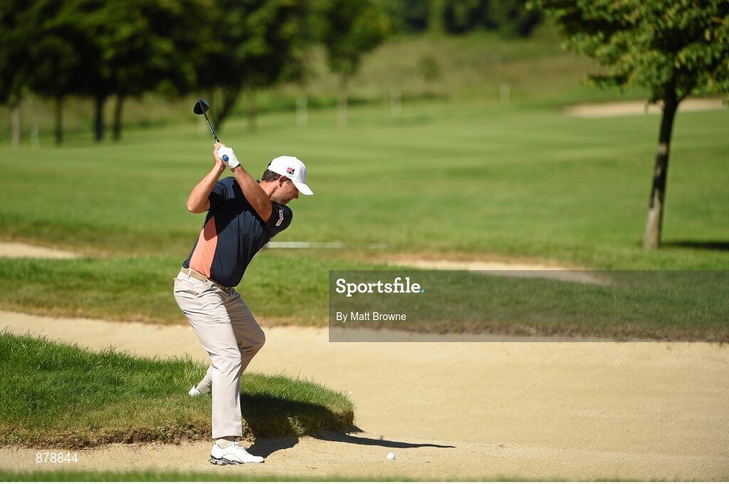 18 June 2014; Padraig Harrington plays his second shot from a fairway bunker onto the fourth green during the 2014 Irish Open Golf Championship Pro-Am. Fota Island, Cork. Picture credit: Matt Browne / SPORTSFILE