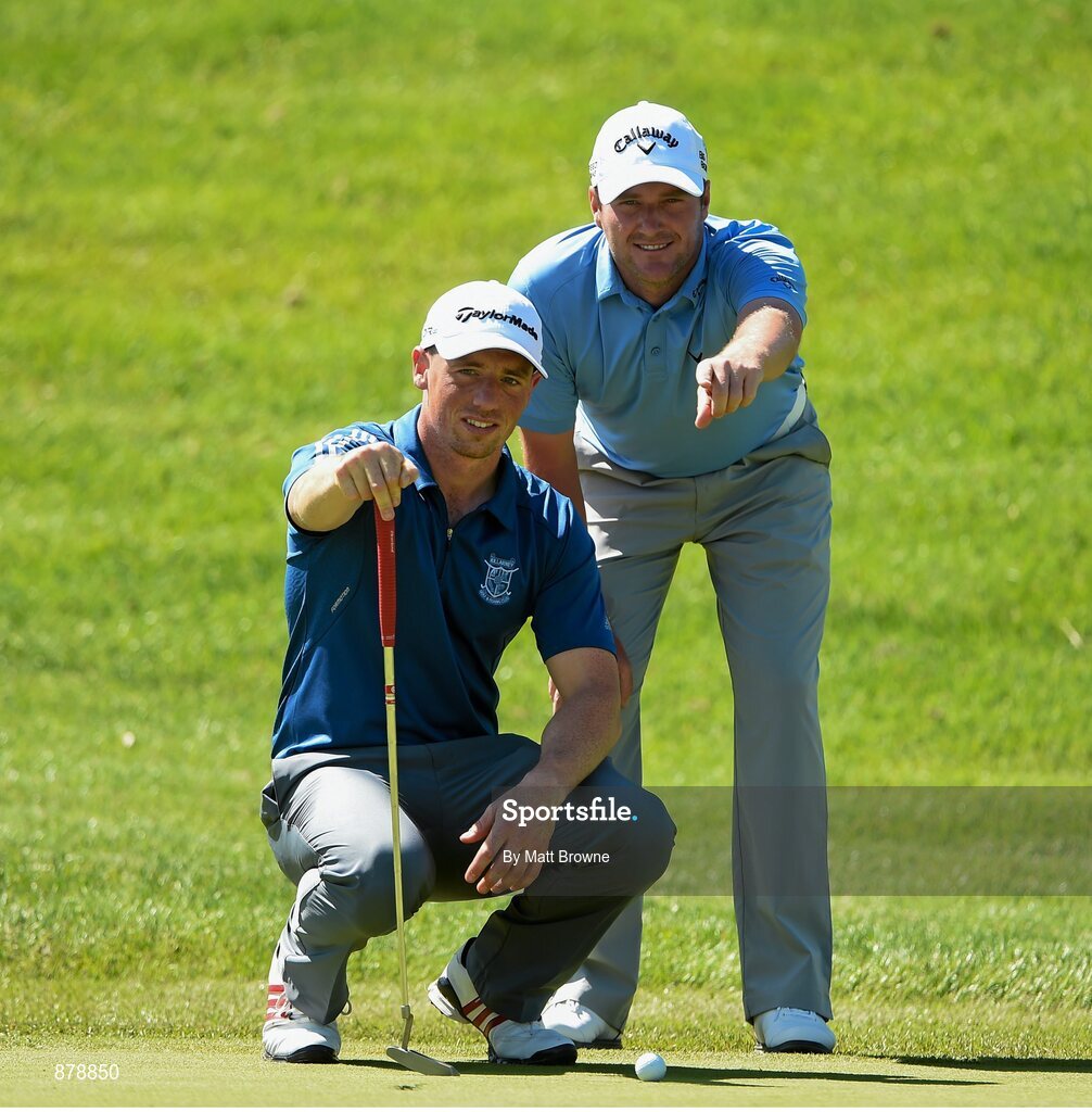 18 June 2014; European tour player Marc Warren, right, lines up a putt for Cork hurler Anthony Nash on the seventh green during the 2014 Irish Open Golf Championship Pro-Am. Fota Island, Cork. Picture credit: Matt Browne / SPORTSFILE