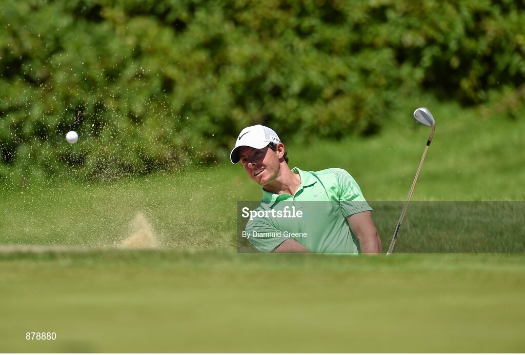 18 June 2014; Rory McIlroy chips out of a bunker by the first green during the 2014 Irish Open Golf Championship Pro-Am. Fota Island, Cork. Picture credit: Diarmuid Greene / SPORTSFILE