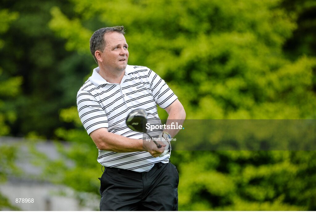18 June 2014; Clare hurling manager Davy Fitzgerald watches his tee shot from the first teebox during the 2014 Irish Open Golf Championship Pro-Am. Fota Island, Cork. Picture credit: Matt Browne / SPORTSFILE