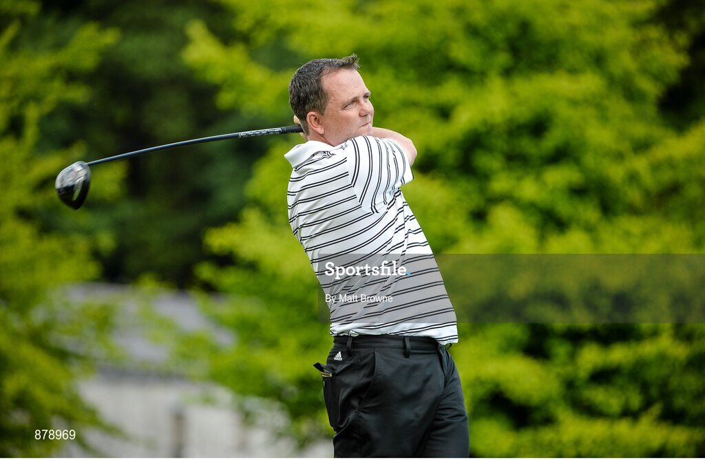 18 June 2014; Clare hurling manager Davy Fitzgerald watches his tee shot from the first teebox during the 2014 Irish Open Golf Championship Pro-Am. Fota Island, Cork. Picture credit: Matt Browne / SPORTSFILE