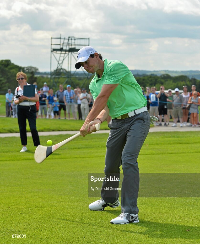 18 June 2014; Rory McIlroy hits a golf ball with a hurley on the 9th fairway during the 2014 Irish Open Golf Championship Pro-Am. Fota Island, Cork. Picture credit: Diarmuid Greene / SPORTSFILE