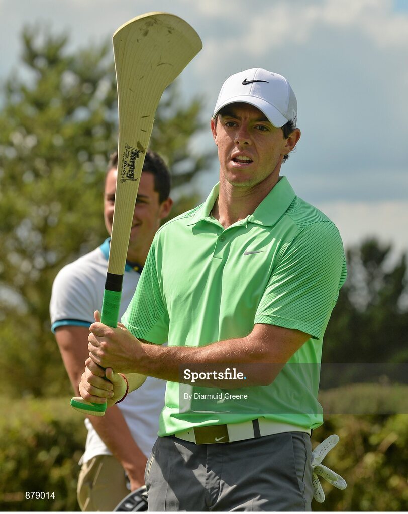 18 June 2014; Rory McIlroy practices his hurling skills on the 9th fairway during the 2014 Irish Open Golf Championship Pro-Am. Fota Island, Cork. Picture credit: Diarmuid Greene / SPORTSFILE