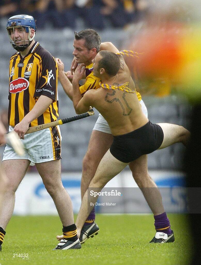 2 July 2006; A supporter jumps on the back of Declan Ruth, Wexford, during the second half. Guinness Leinster Senior Hurling Championship Final, Wexford v Kilkenny, Croke Park, Dublin. Picture credit: David Maher / SPORTSFILE