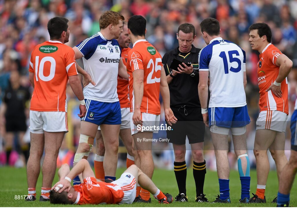 28 June 2014; Referee Joe McQuillan awards Monaghan's Conor McManus, 15, a black card after an incident with Armagh's Finnian Moriarty, below. Ulster GAA Football Senior Championship, Semi-Final, Armagh v Monaghan, St Tiernach's Park, Clones, Co. Monaghan. Picture credit: Ramsey Cardy / SPORTSFILE