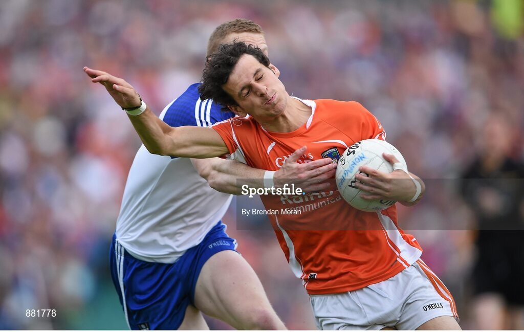 28 June 2014; Jamie Clarke, Armagh, is tackled by Colin Walshe, Monaghan. Ulster GAA Football Senior Championship, Semi-Final, Armagh v Monaghan, St Tiernach's Park, Clones, Co. Monaghan. Picture credit: Brendan Moran / SPORTSFILE