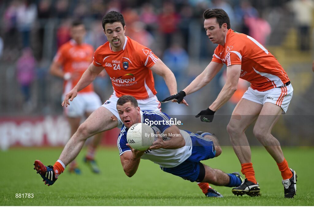 28 June 2014; Padraig Donaghy, Monaghan, in action against Aidan Forker, left, and Tony Kernan, Armagh. Ulster GAA Football Senior Championship, Semi-Final, Armagh v Monaghan, St Tiernach's Park, Clones, Co. Monaghan. Picture credit: Brendan Moran / SPORTSFILE