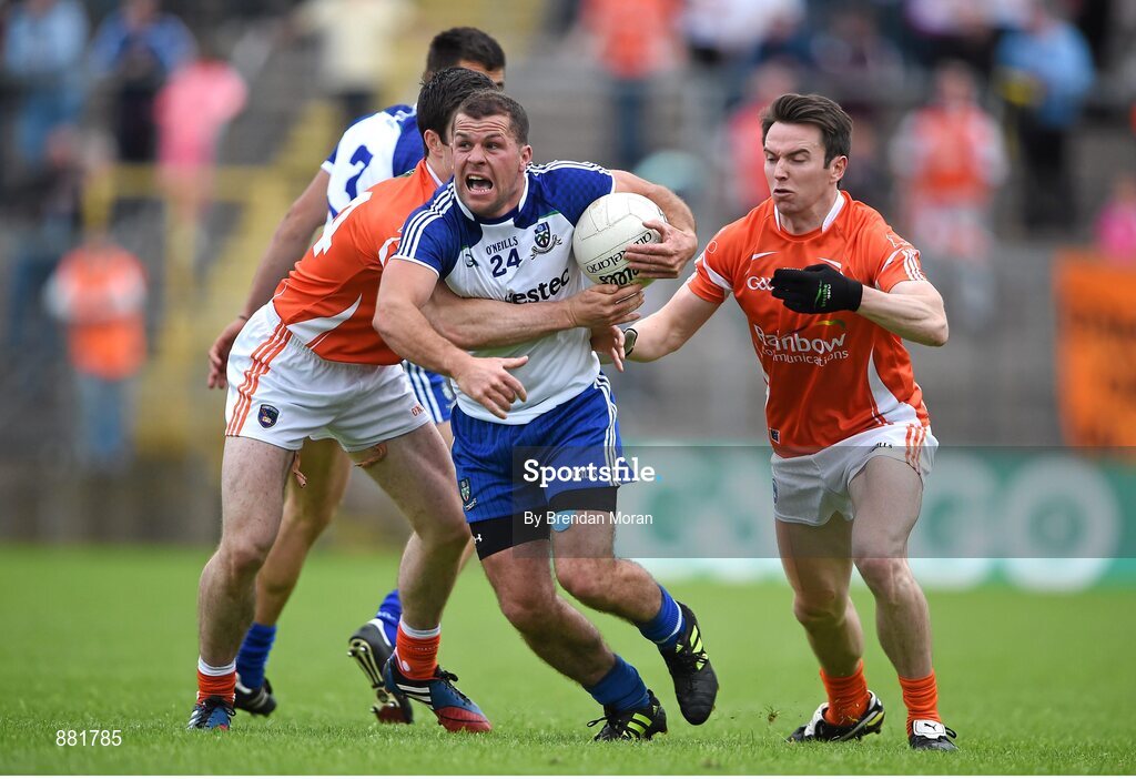 28 June 2014; Padraig Donaghy, Monaghan, is tackled by Aidan Forker, left, and Tony Kernan, Armagh. Ulster GAA Football Senior Championship, Semi-Final, Armagh v Monaghan, St Tiernach's Park, Clones, Co. Monaghan. Picture credit: Brendan Moran / SPORTSFILE