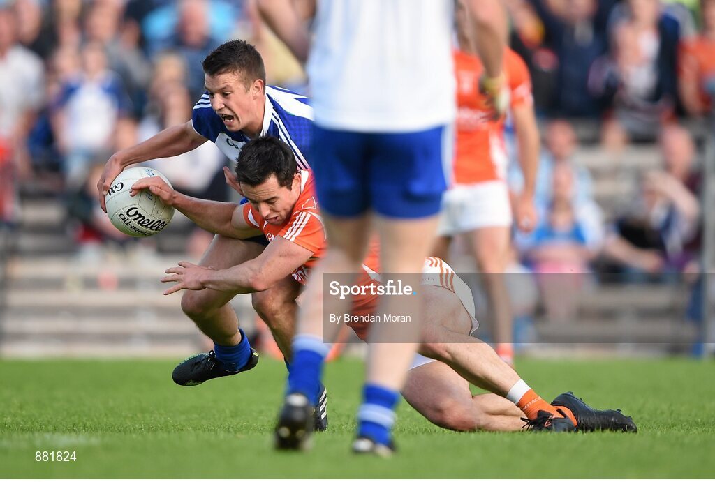 28 June 2014; Ryan Wylie, left, Monaghan, and Aaron Kernan, Armagh, contest the last ball of the game. Referee Joe McQuillan subsequently awarded a free to Armagh who kicked a point to equalise and send the game to a replay. Ulster GAA Football Senior Championship, Semi-Final, Armagh v Monaghan, St Tiernach's Park, Clones, Co. Monaghan. Picture credit: Brendan Moran / SPORTSFILE Picture credit: Brendan Moran / SPORTSFILE