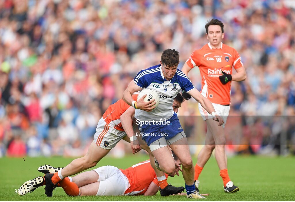 28 June 2014; Darren Hughes, Monaghan, beats the tackle of James Morgan, left, Ciaran McKeever, centre, and Tony Kernan, Armagh. Ulster GAA Football Senior Championship, Semi-Final, Armagh v Monaghan, St Tiernach's Park, Clones, Co. Monaghan. Picture credit: Ramsey Cardy / SPORTSFILE