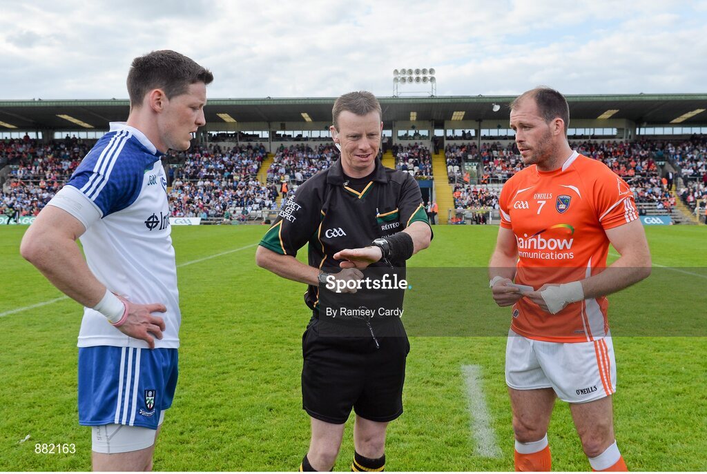 28 June 2014; Referee Joe McQuillan performs the pre-match coin toss in the company of Monaghan captain Conor McManus and Armagh captain Ciaran McKeever. Ulster GAA Football Senior Championship, Semi-Final, Armagh v Monaghan, St Tiernach's Park, Clones, Co. Monaghan. Picture credit: Ramsey Cardy / SPORTSFILE