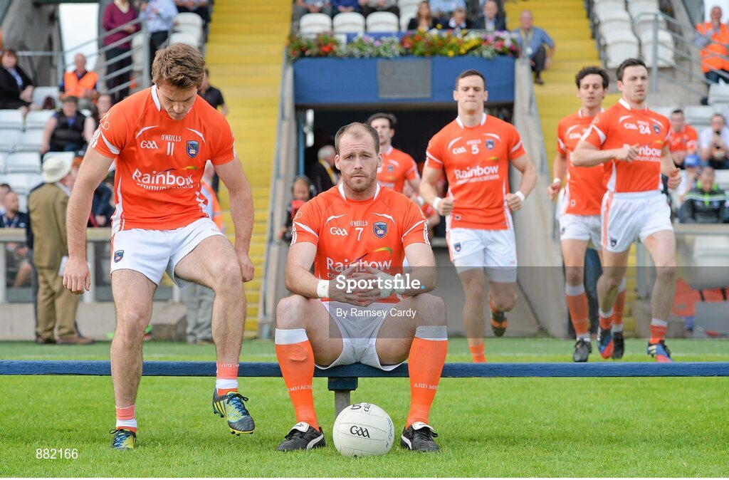 28 June 2014; Armagh captain Ciaran McKeever awaits the rest of his team-mates before the pre-match team photograph. Ulster GAA Football Senior Championship, Semi-Final, Armagh v Monaghan, St Tiernach's Park, Clones, Co. Monaghan. Picture credit: Ramsey Cardy / SPORTSFILE