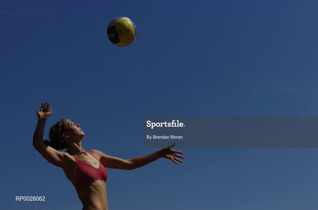 15 July 2006; Jen Walsh serves to Eleanor Dunne and Miriam Gormally during their match. Coca-Cola Bray Beach Volleyball Event, Sand Area, Women's Round Robin, Dunne / Gormally  v Counihan / J. Walsh,  Bray Beach, Bray, Co. Wicklow. Picture credit: Brendan Moran / SPORTSFILE