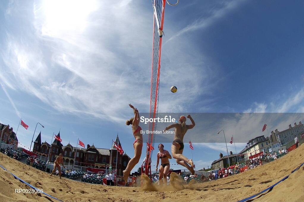 15 July 2006; Leanne Dignam prepares to spike the ball as Jen Walsh blocks during their game. Coca-Cola Bray Beach Volleyball Event, Sand Area, Women's Round Robin, Dignam / P. Walsh v Counihan / J. Walsh, Bray Beach, Bray, Co. Wicklow. Picture credit: Brendan Moran / SPORTSFILE