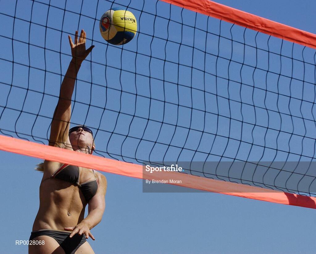 15 July 2006; Leanne Dignam spike the ball against Noya Kuncik and Ollie Rossiter. Coca-Cola Bray Beach Volleyball Event, Sand Area, Women's Round Robin, Dignam / P. Walsh v Kuncik / Rossiter, Bray Beach, Bray, Co. Wicklow. Picture credit: Brendan Moran / SPORTSFILE