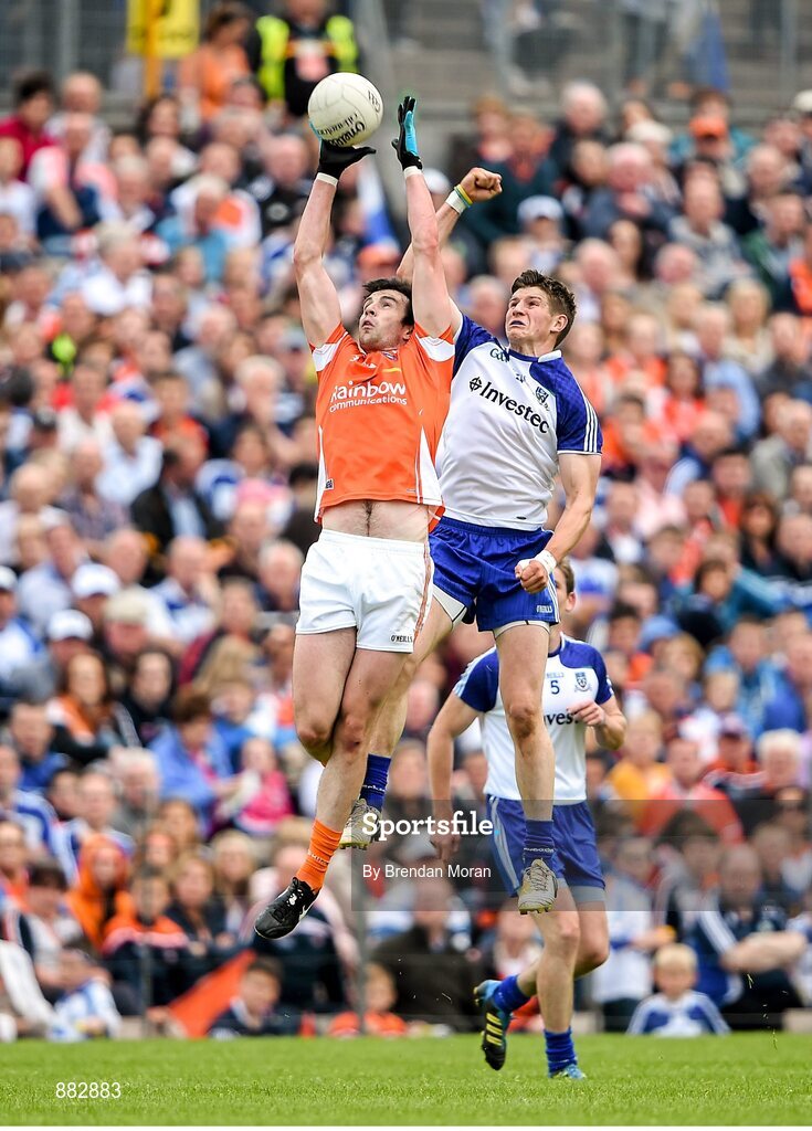 28 June 2014; Aaron Findon, Armagh, contests a kick out with Darren Hughes, Monaghan. Ulster GAA Football Senior Championship, Semi-Final, Armagh v Monaghan, St Tiernach's Park, Clones, Co. Monaghan. Picture credit: Brendan Moran / SPORTSFILE