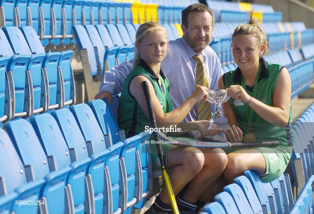 20 July 2006; Sean Kelly, newly appointed Executive Chairman of the The Irish Institute of Sport, with Nicola Evans, right Vice-Captain, and Chloe Watkins, members of the Ireland U16 girls hockey team who recently won bronze medal in the EuroHockey Youth Nations Championships in Valencia, Spain. Belfield, UCD, Dublin. Picture credit: Brian Lawless / SPORTSFILE