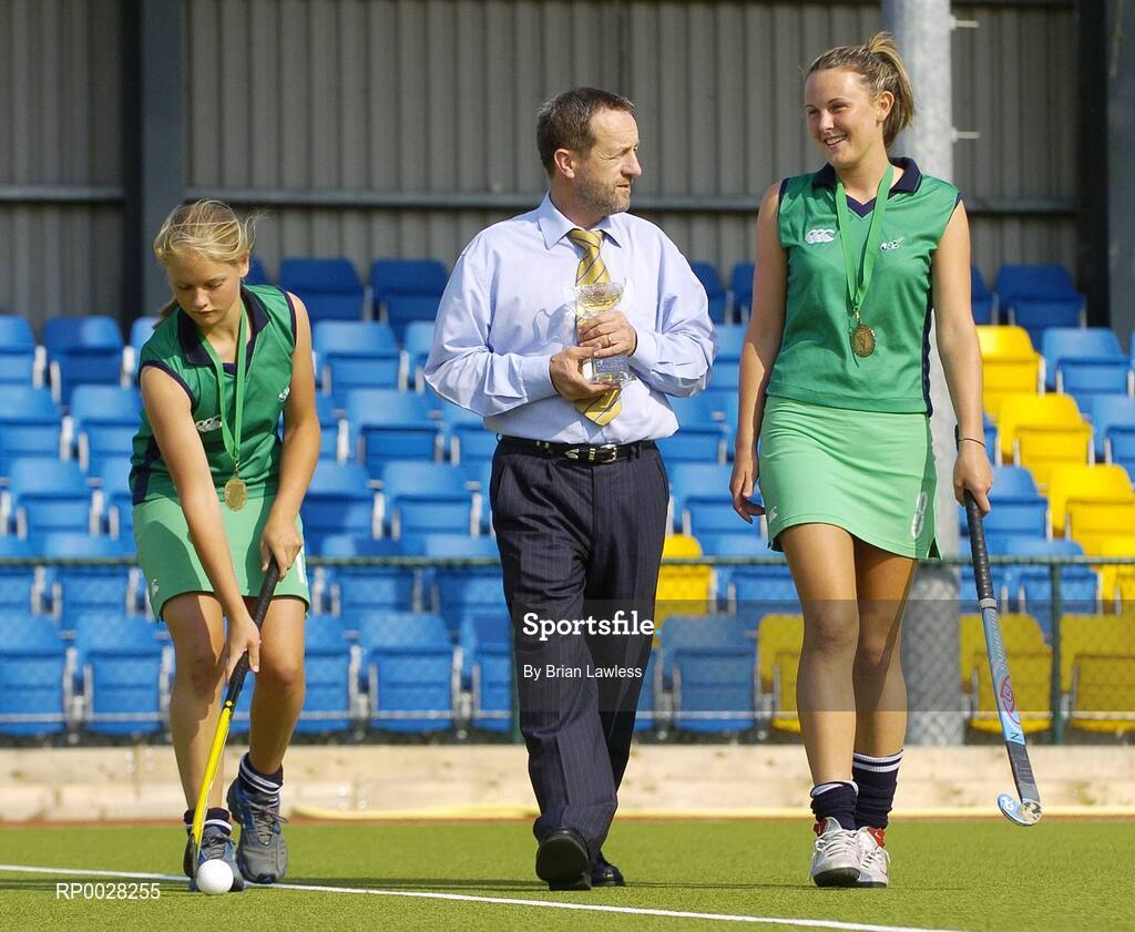 20 July 2006; Sean Kelly, newly appointed Executive Chairman of the The Irish Institute of Sport, with Nicola Evans, right, Vice-Captain, and Chloe Watkins, members of the Ireland U16 girls hockey team who recently won bronze medal in the EuroHockey Youth Nations Championships in Valencia, Spain. Belfield, UCD, Dublin. Picture credit: Brian Lawless / SPORTSFILE