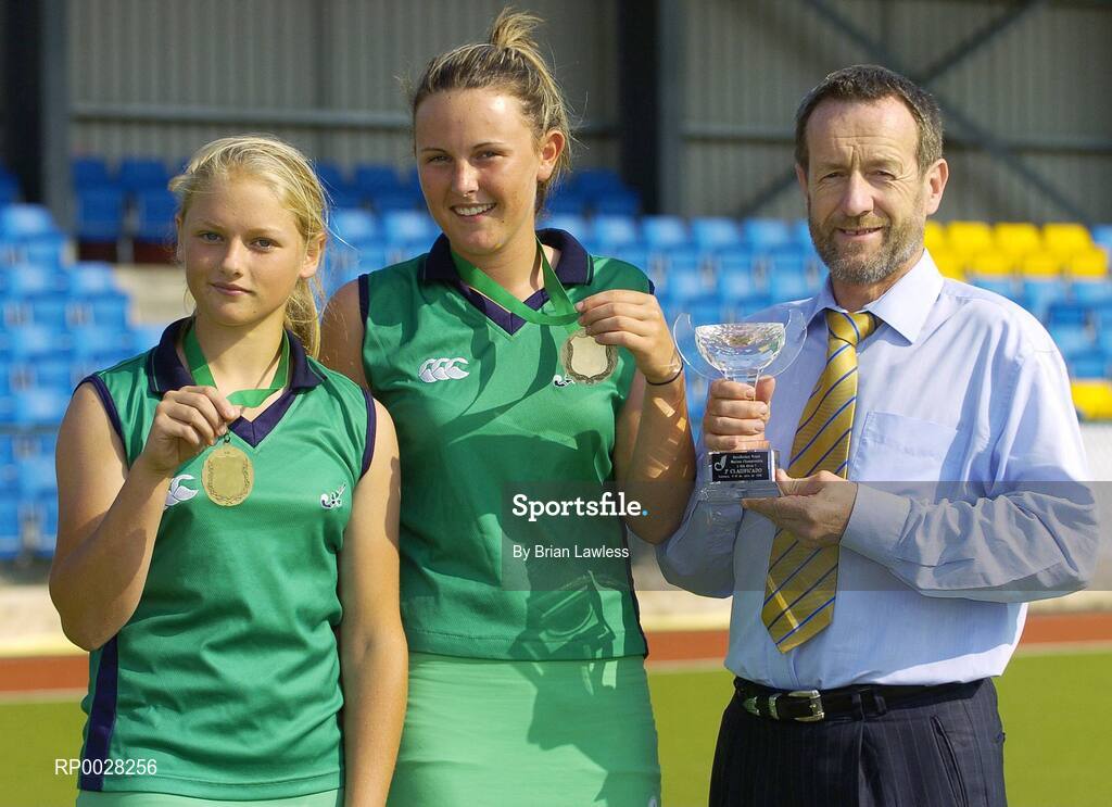 20 July 2006; Sean Kelly, newly appointed Executive Chairman of the The Irish Institute of Sport, with Nicola Evans, Vice-Captain, and Chloe Watkins, left, members of the Ireland U16 girls hockey team who recently won bronze medal in the EuroHockey Youth Nations Championships in Valencia, Spain. Belfield, UCD, Dublin. Picture credit: Brian Lawless / SPORTSFILE
