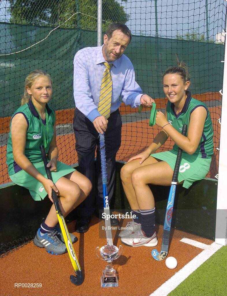 20 July 2006; Sean Kelly, newly appointed Executive Chairman of the The Irish Institute of Sport, with Nicola Evans, right, Vice-Captain, and Chloe Watkins, members of the Ireland U16 girls hockey team who recently won bronze medal in the EuroHockey Youth Nations Championships in Valencia, Spain. Belfield, UCD, Dublin. Picture credit: Brian Lawless / SPORTSFILE