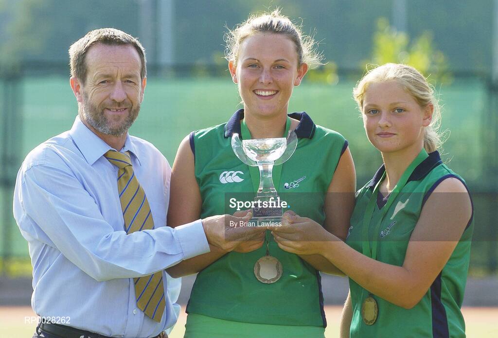20 July 2006; Sean Kelly, newly appointed Executive Chairman of the The Irish Institute of Sport, with Nicola Evans, centre, Vice-Captain, and Chloe Watkins, members of the Ireland U16 girls hockey team who recently won bronze medal in the EuroHockey Youth Nations Championships in Valencia, Spain. Belfield, UCD, Dublin. Picture credit: Brian Lawless / SPORTSFILE