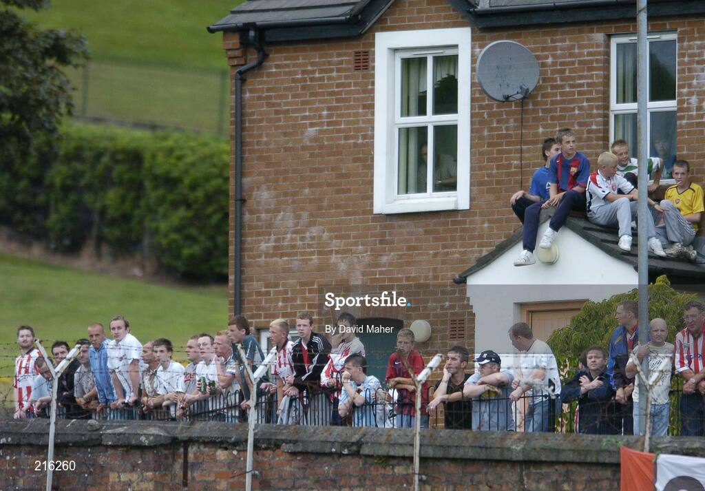 27 July 2006; Spectators watch on from a vantage point outside the ground during the game. UEFA Cup 1st Round, 2nd Leg, Derry City v IFK Gotheburg, Brandywell, Derry. Picture credit; David Maher / SPORTSFILE