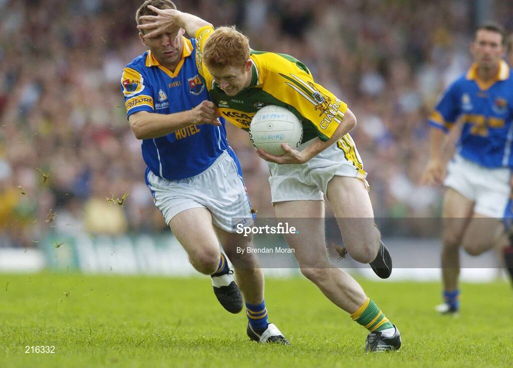 29 July 2006; Colm Cooper, Kerry, holds off the challenge of Cathal Conefrey, Longford. Bank of Ireland All-Ireland Senior Football Championship Qualifier, Round 4, Kerry v Longford, Fitzgerald Stadium, Killarney, Co. Kerry. Picture credit; Brendan Moran / SPORTSFILE