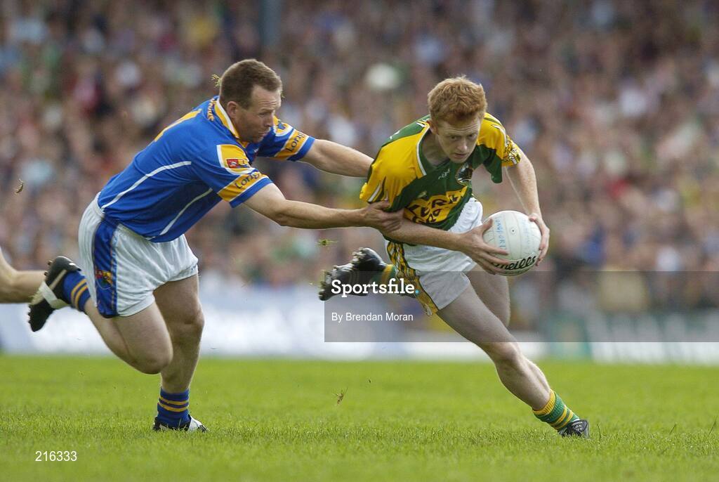 29 July 2006; Colm Cooper, Kerry, holds off the challenge of Cathal Conefrey, Longford. Bank of Ireland All-Ireland Senior Football Championship Qualifier, Round 4, Kerry v Longford, Fitzgerald Stadium, Killarney, Co. Kerry. Picture credit; Brendan Moran / SPORTSFILE