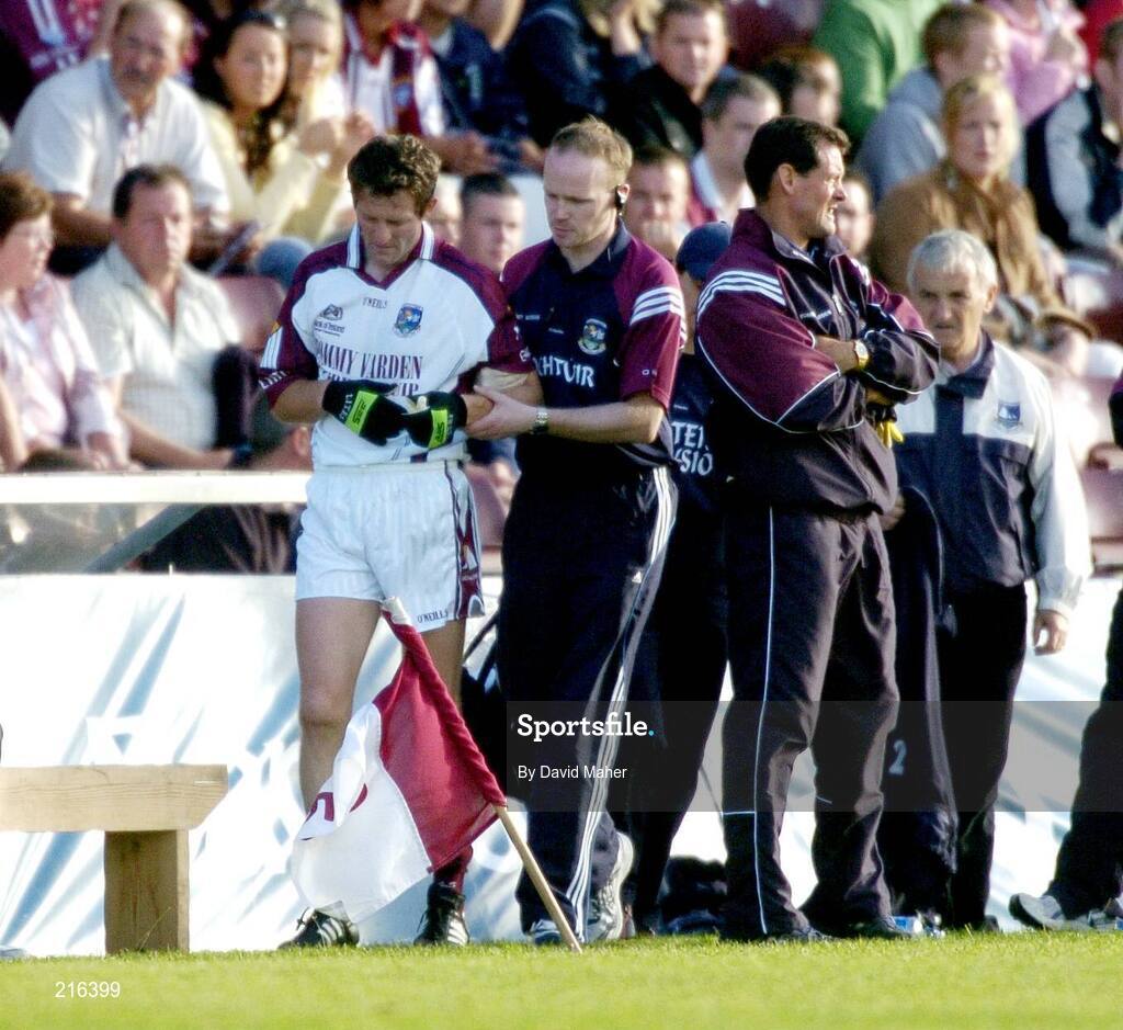 29 July 2006; Ja Fallon, Galway, is helped along the sideline by a member of the medical staff after a clash with Westmeath goalkeeper, Gary Connaughton. Bank of Ireland All-Ireland Senior Football Championship Qualifier, Round 4, Galway v Westmeath, Pearse Stadium, Galway. Picture credit; David Maher / SPORTSFILE