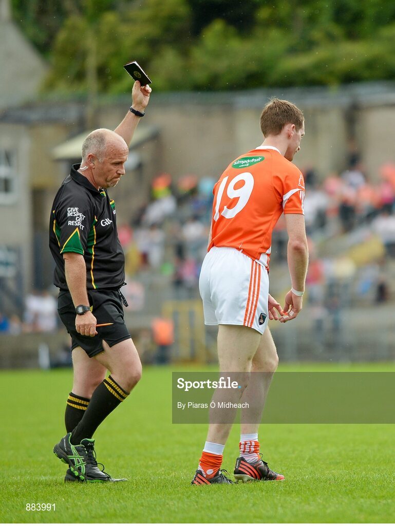 6 July 2014; Finnian Moriarty, Armagh, leaves the field after being shown a black card by referee Marty Duffy. Ulster GAA Football Senior Championship, Semi-Final Replay, Armagh v Monaghan, St Tiernach's Park, Clones, Co. Monaghan. Picture credit: Piaras Ó Mídheach / SPORTSFILE