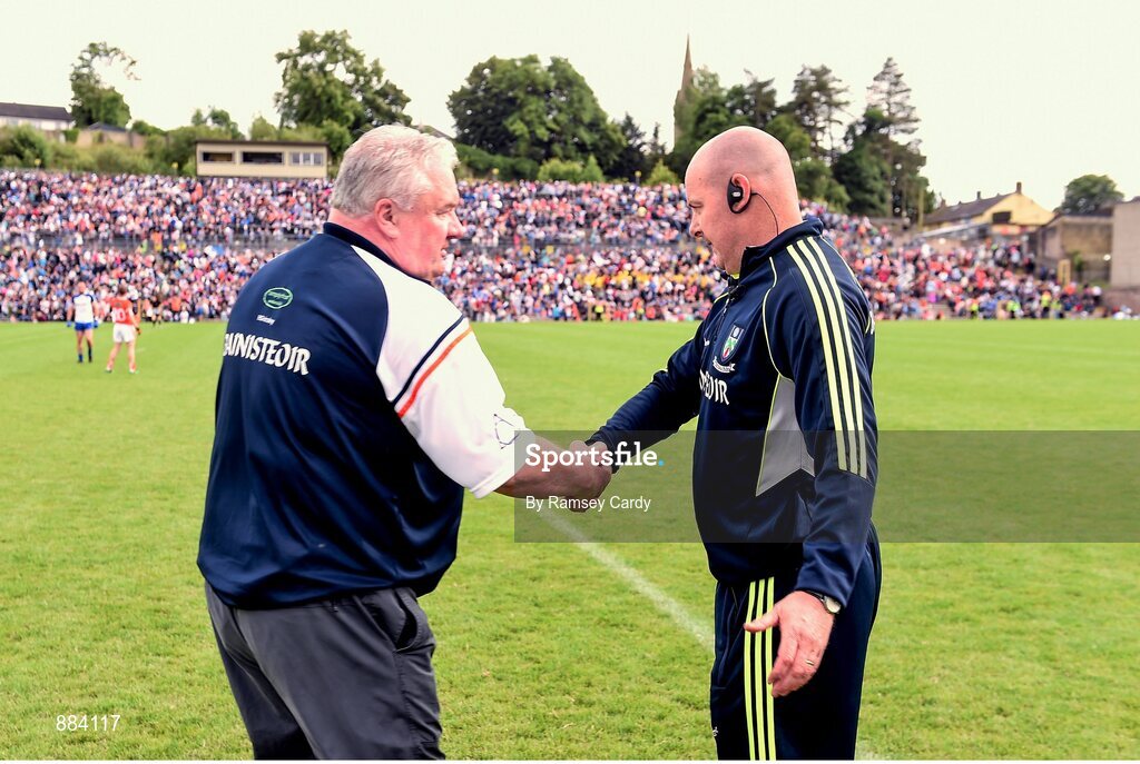 6 July 2014; Armagh manager Paul Grimley, left, shakes hands with Monaghan manager Malachy O'Rourke at the end of the game. Ulster GAA Football Senior Championship, Semi-Final Replay, Armagh v Monaghan, St Tiernach's Park, Clones, Co. Monaghan. Picture credit: Ramsey Cardy / SPORTSFILE