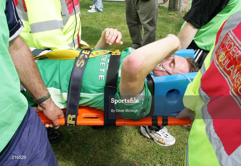 30 July 2006; Eamon Maguire, Fermanagh, carried off with a suspected broken jaw after a tackle with Ciaran Bonner, Donegal. Bank of Ireland All-Ireland Senior Football Championship Qualifier, Round 4, Fermanagh v Donegal, Brewster Park, Enniskillen, Co. Fermanagh. Picture credit; Oliver McVeigh / SPORTSFILE