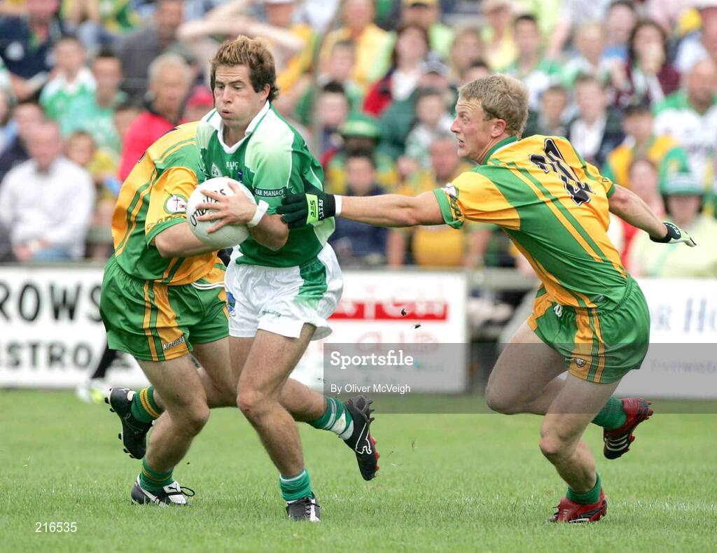 30 July 2006; Ryan Keenan, Fermanagh, in action against Neil McGee and Thomas Donaghue, Donegal. Bank of Ireland All-Ireland Senior Football Championship Qualifier, Round 4, Fermanagh v Donegal, Brewster Park, Enniskillen, Co. Fermanagh. Picture credit; Oliver McVeigh / SPORTSFILE