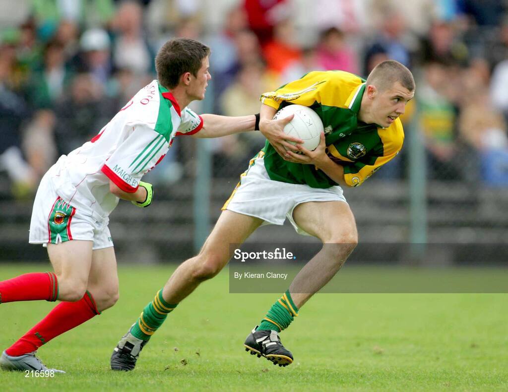 30 July 2006; Michael Moloney, Kerry, in action against Michael Sweeney, Mayo. ESB All-Ireland Minor Football Championship Quarter-Final, Kerry v Mayo, Cusack Park, Ennis, Co. Clare. Picture credit; Kieran Clancy / SPORTSFILE