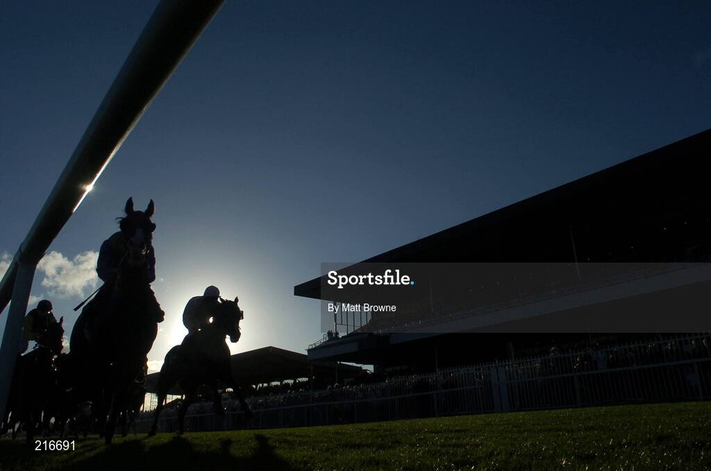 31 July 2006; The runners and riders pass the main stand first time round during the G.P.T. Van and Truck Rentals Handicap. Galway Races, Ballybrit, Co. Galway. Picture credit; Matt Browne / SPORTSFILE
