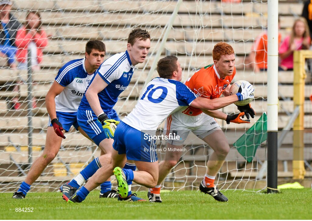 6 July 2014; Kyle Carragher, Armagh, in action against Monaghan players, from left, Drew Wyle, Rory Beggan, and Ryan Wylie. Ulster GAA Football Senior Championship, Semi-Final Replay, Armagh v Monaghan, St Tiernach's Park, Clones, Co. Monaghan. Picture credit: Piaras Ó Mídheach / SPORTSFILE