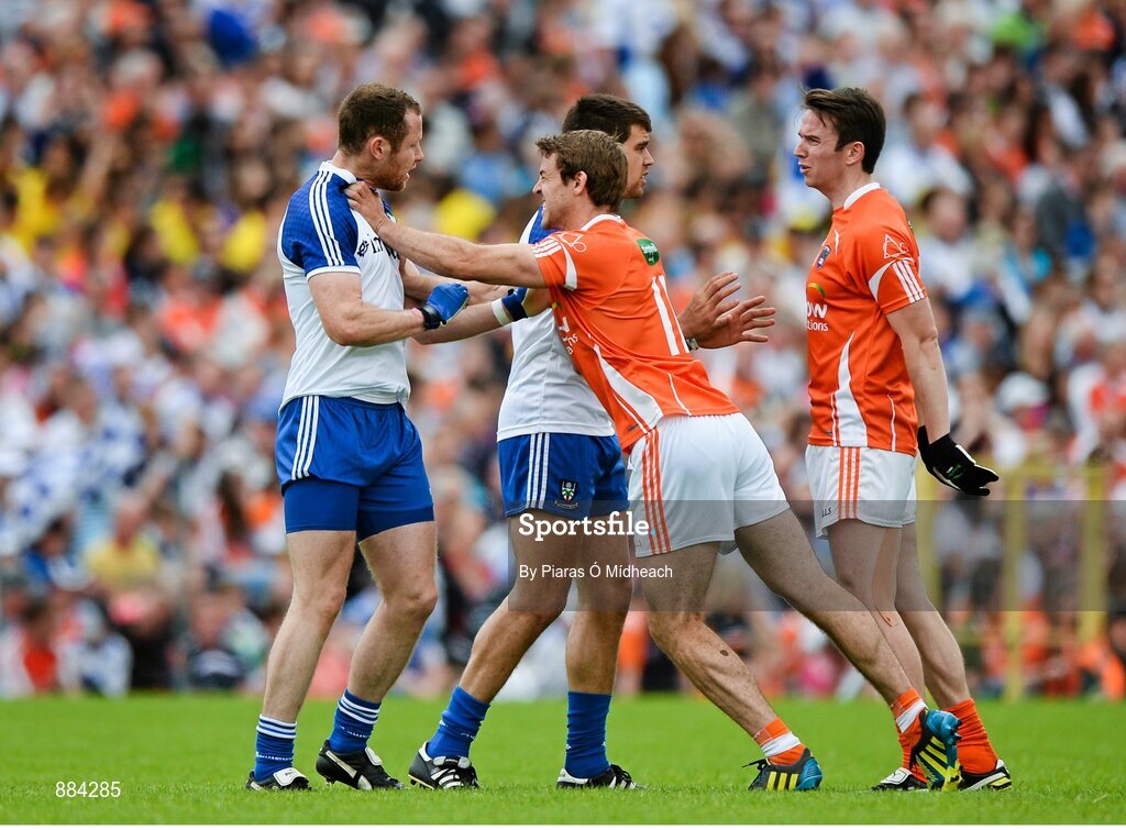 6 July 2014; Monaghan players Vinny Corey, left, and Drew Wylie, become involved in an off the ball tussle with Armagh's Kevin Dyas and Tony Kernan, right. Ulster GAA Football Senior Championship, Semi-Final Replay, Armagh v Monaghan, St Tiernach's Park, Clones, Co. Monaghan. Picture credit: Piaras Ó Mídheach / SPORTSFILE