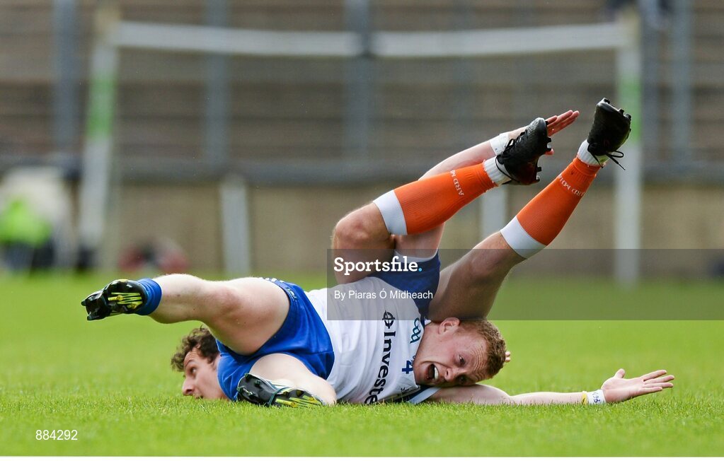 6 July 2014; Colin Walshe, Monaghan, and Jamie Clarke, behind, get in a tussle off the ball. Ulster GAA Football Senior Championship, Semi-Final Replay, Armagh v Monaghan, St Tiernach's Park, Clones, Co. Monaghan. Picture credit: Piaras Ó Mídheach / SPORTSFILE
