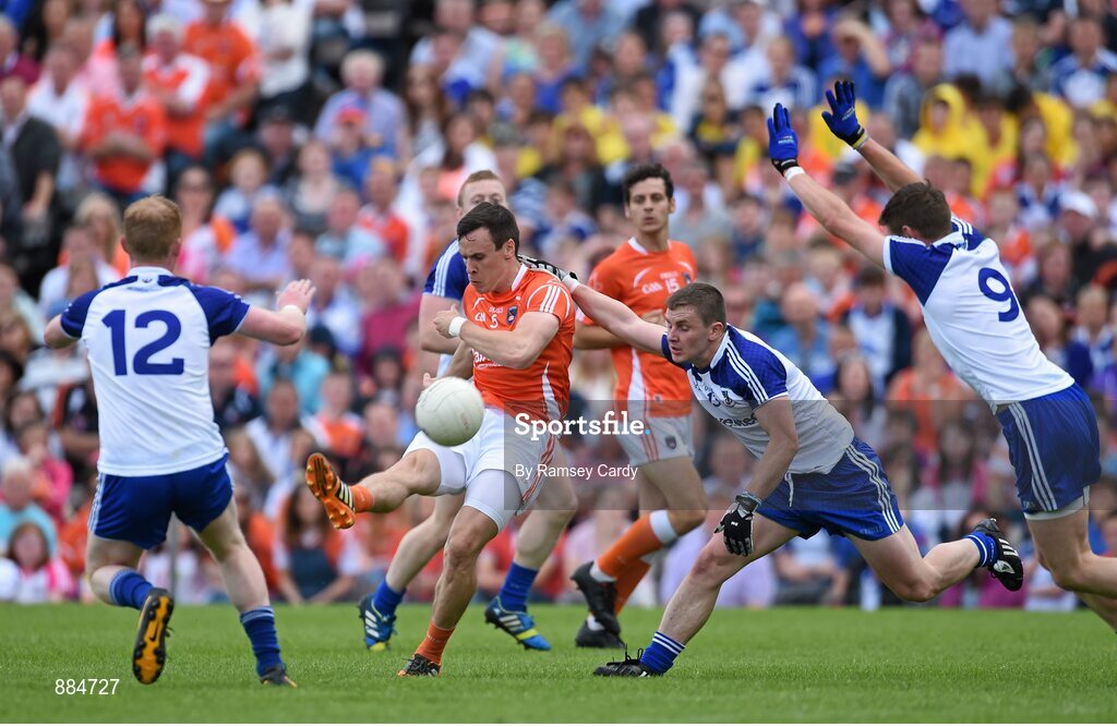 6 July 2014; Mark Shields, Armagh, in action against Paudie McKenna, left, Dermot Malone, centre, and Darren Hughes , Monaghan. Ulster GAA Football Senior Championship, Semi-Final Replay, Armagh v Monaghan, St Tiernach's Park, Clones, Co. Monaghan. Picture credit: Ramsey Cardy / SPORTSFILE