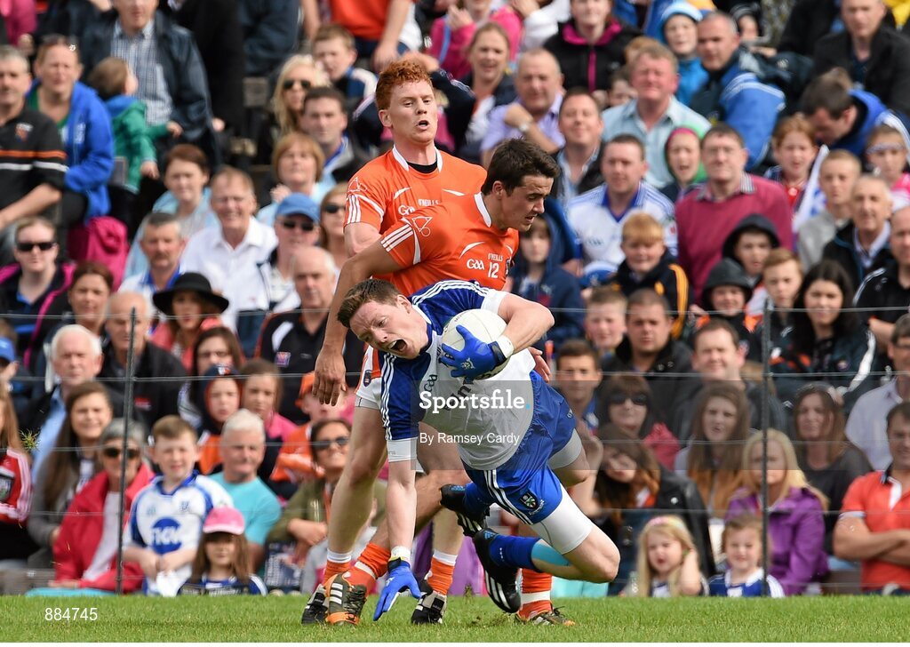 6 July 2014; Conor McManus, Monaghan, is tripped by Stefan Campbell, Armagh, which resulted in a black card. Ulster GAA Football Senior Championship, Semi-Final Replay, Armagh v Monaghan, St Tiernach's Park, Clones, Co. Monaghan. Picture credit: Ramsey Cardy / SPORTSFILE
