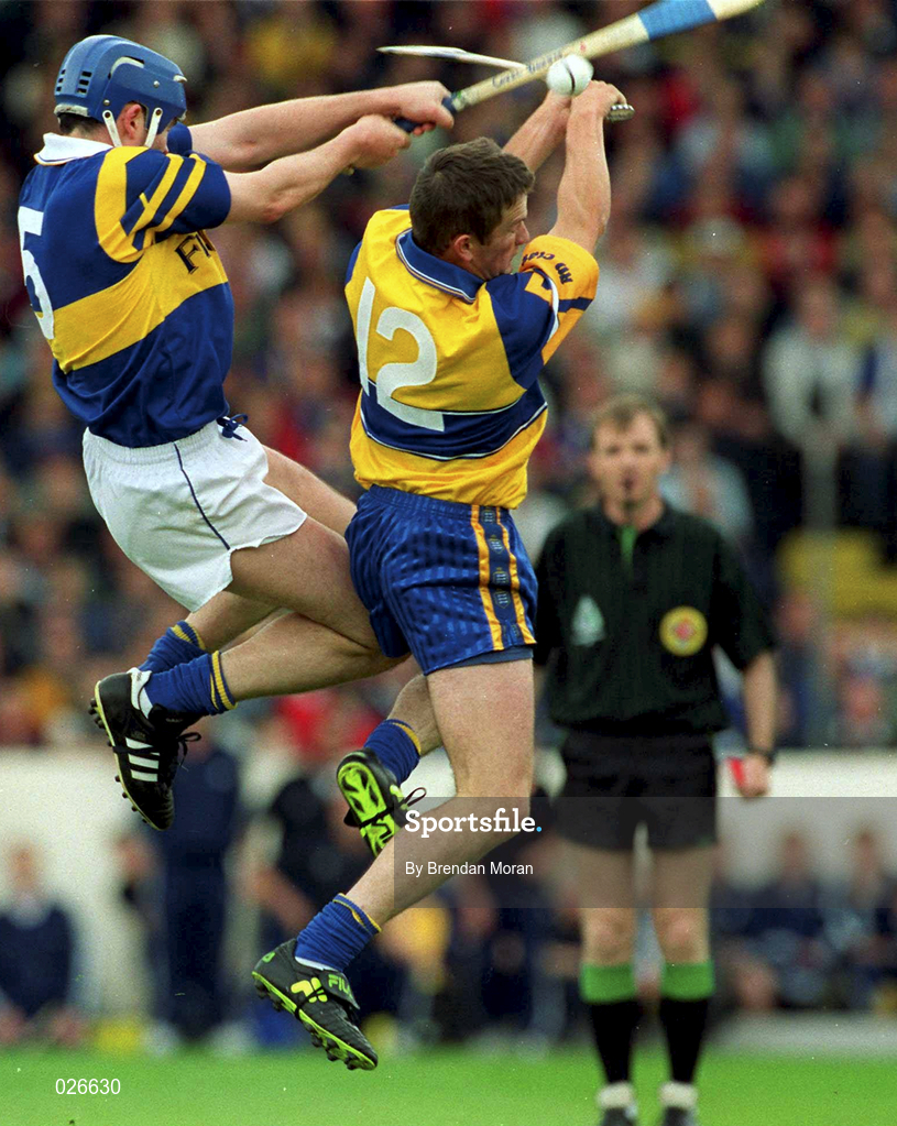 12 June 1999;  Alan Markham of Clare in action against Conal Bonnar of Tipperary during the Munster Senior Hurling Championship Semi final Replay match between Clare v Tipperary at Páirc Uí Chaoimh in Cork. Photo by Brendan Moran/Sportsfile