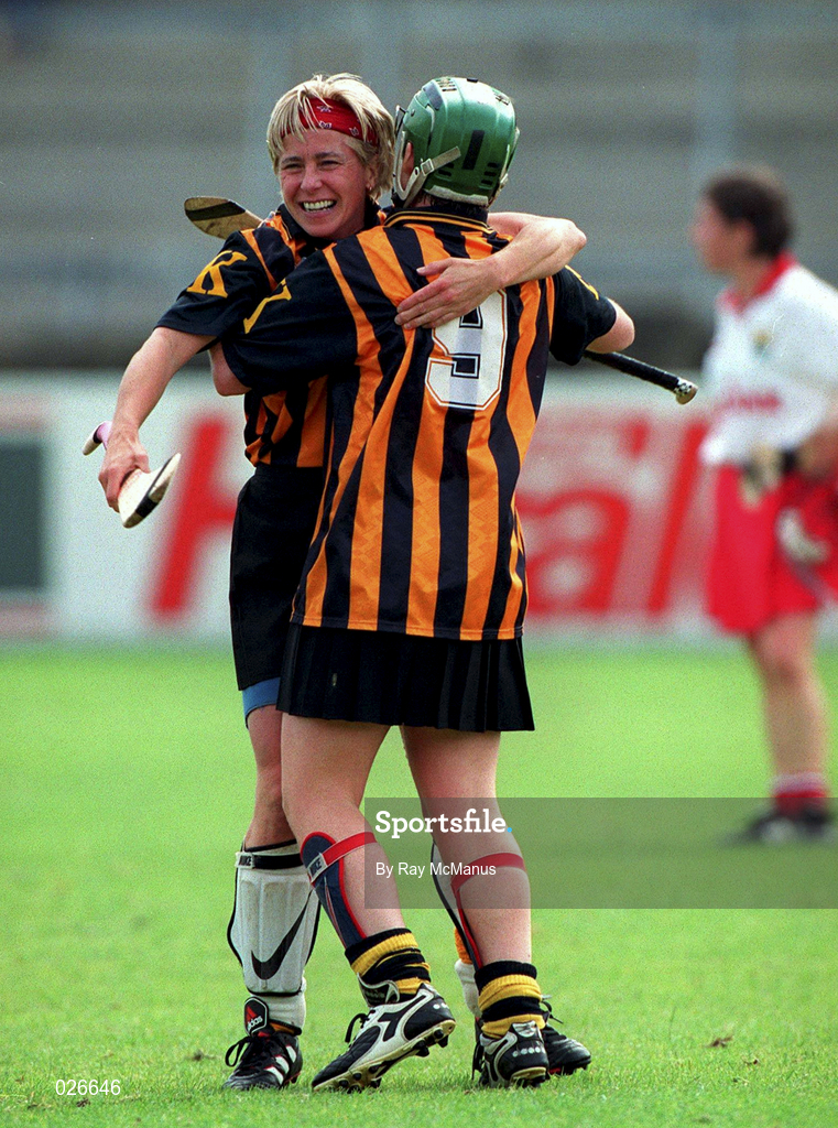 7 August 1999; Kilkenny players Sinéad Millea, 9, and Ann Downey celebrate following the Bórd na Gaeilge All Ireland Senior Camogie Championship Semi-Final match between Cork and Kilkenny at Parnell Park in Dublin. Photo by Ray McManus/Sportsfile